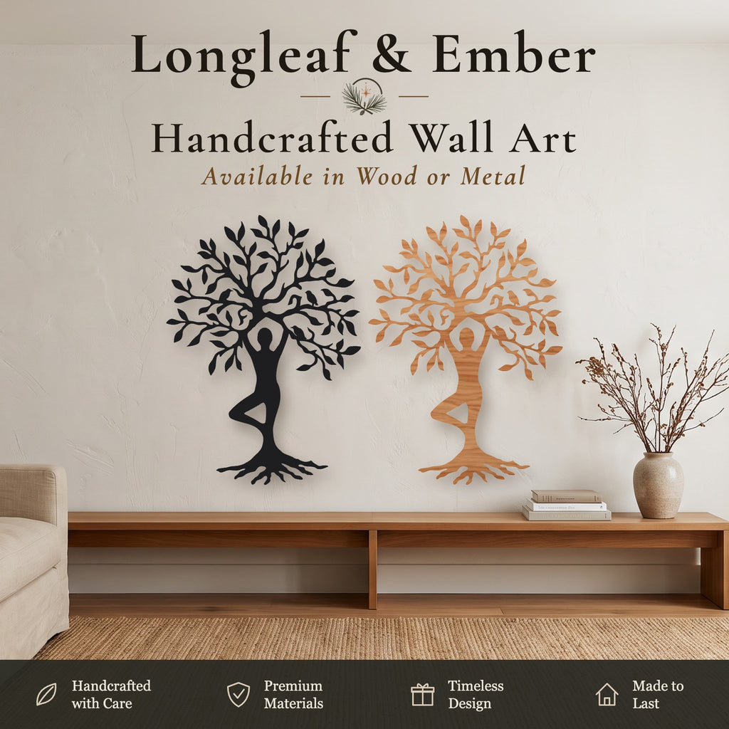 Two handcrafted metal wall art trees, one in black and one in warm amber, displayed on a beige wall above a wooden console table in a styled living room setting. Text overlays at the top and bottom describe the product as 'Longleaf & Ember Handcrafted Wall Art'.