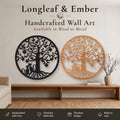 Two round Tree of Life wall art pieces with two cats and heart-shaped leaves, one in black metal and one in stained wood
