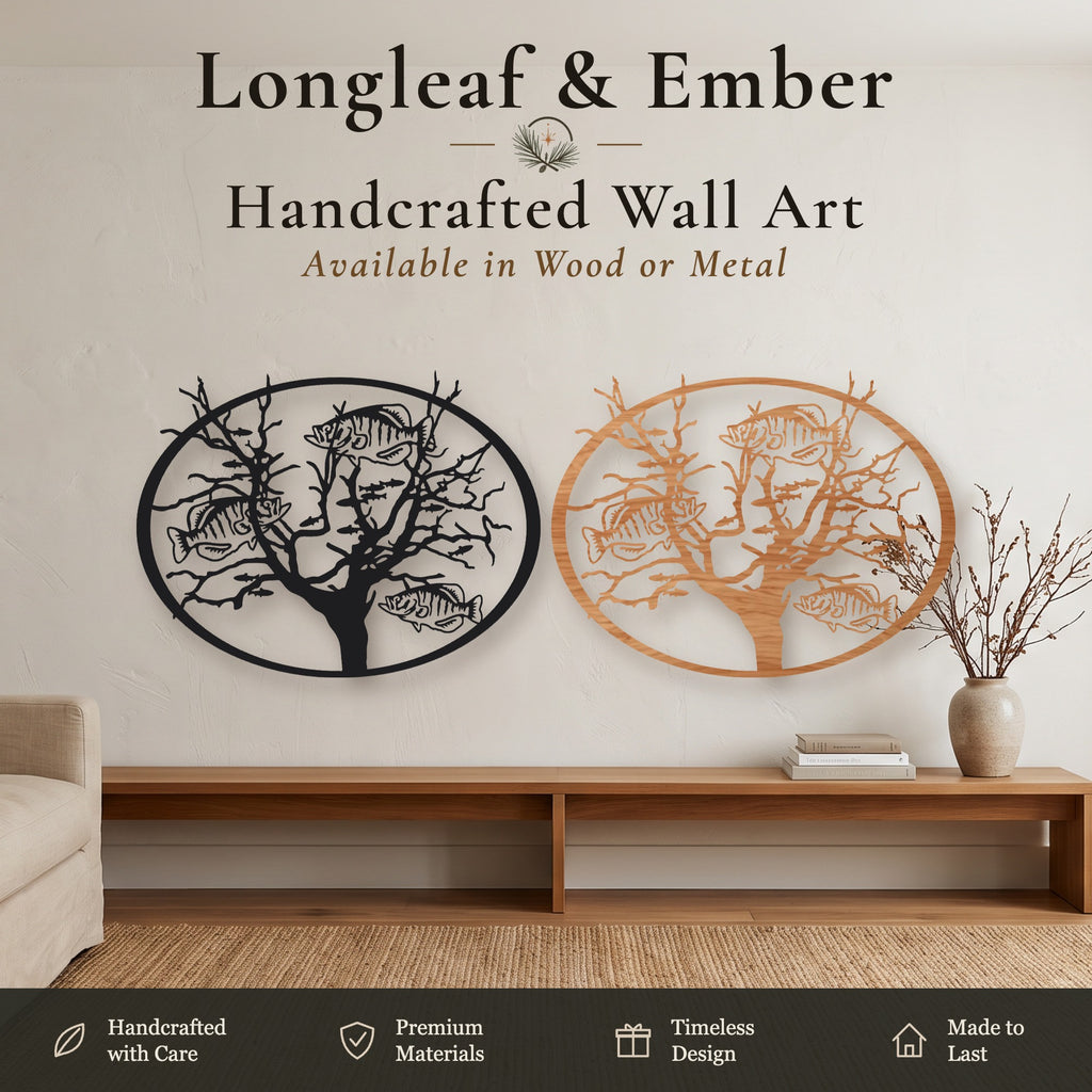 Two oval Tree of Life wall art pieces with fish design, one in black metal and one in stained wood, displayed above a wooden console table.