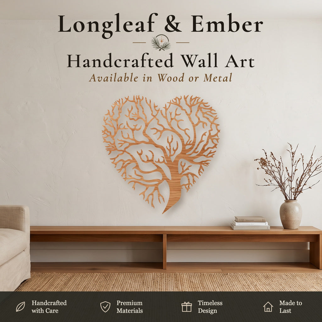 A heart-shaped wooden wall art piece with an intricate tree design mounted on a beige wall in a styled living room setting. Text at the top reads 'Longleaf & Ember Handcrafted Wall Art Available in Wood or Metal', and a feature banner runs along the bottom.