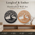 Two round ancient oak Tree of Life wall art pieces, one in black metal and one in stained wood, displayed above a wooden console table