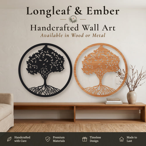 Two round Tree of Life wall art pieces, one in black metal and one in stained wood, displayed above a wooden console table.
